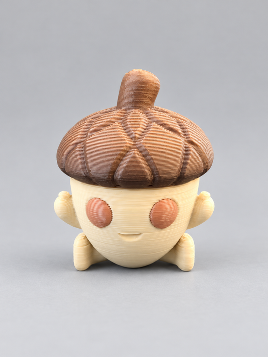 3D-printed acorn character with brown cap and cream body