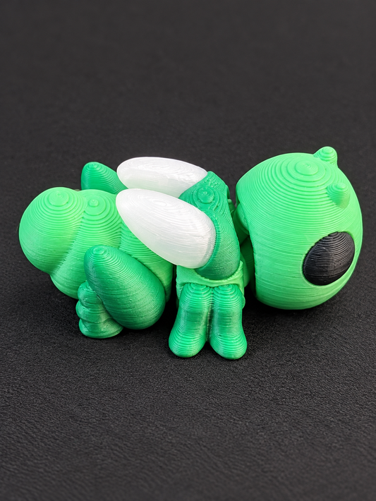Green articulated 3D-printed grasshopper with white wings