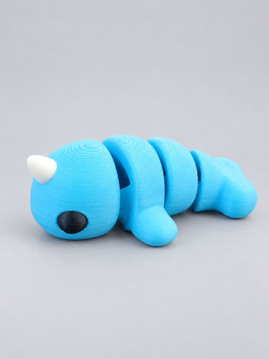 Blue articulated narwhal with a white tusk