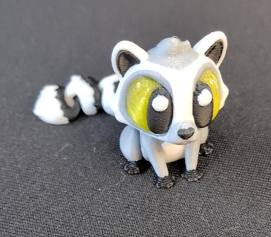 White and black 3D printed lemur with large eyes and a black-and-white ringed tail
